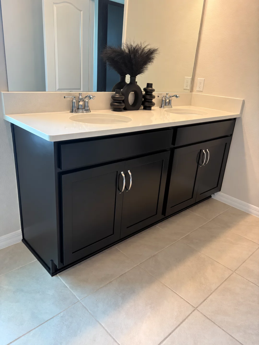 Dark refinished bathroom vanity with a light countertop