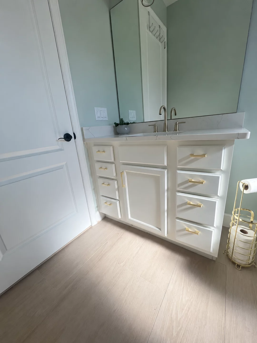 Light painted interior with white doors and bathroom cabinetry