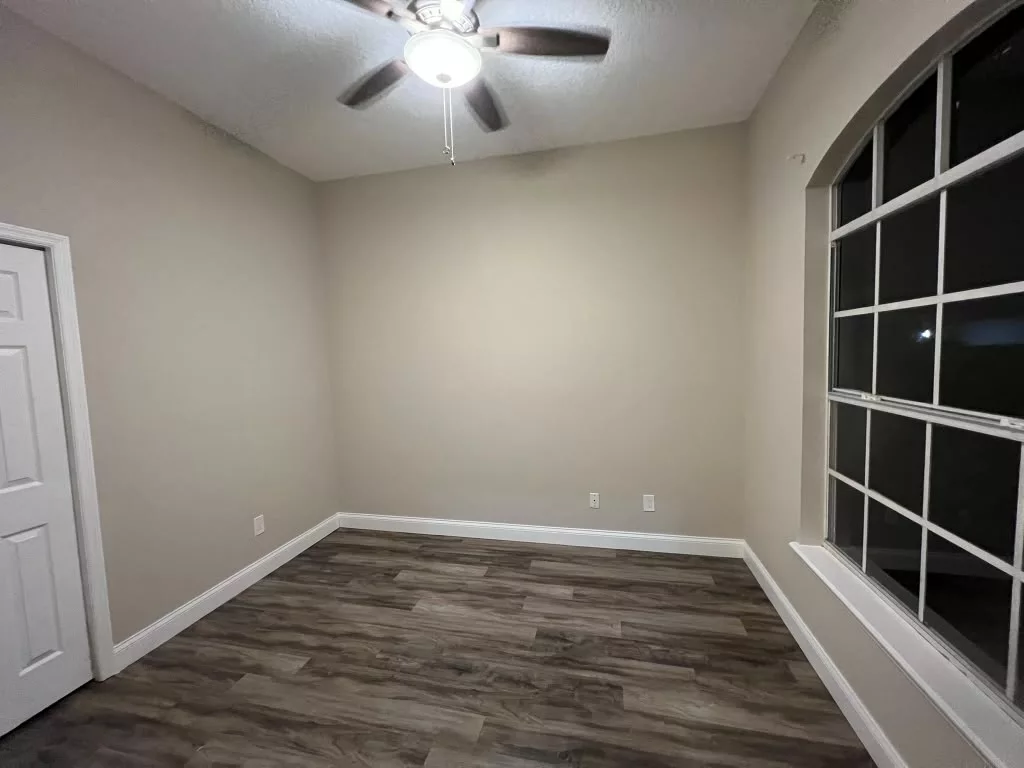 Painted room with neutral walls and white window trim