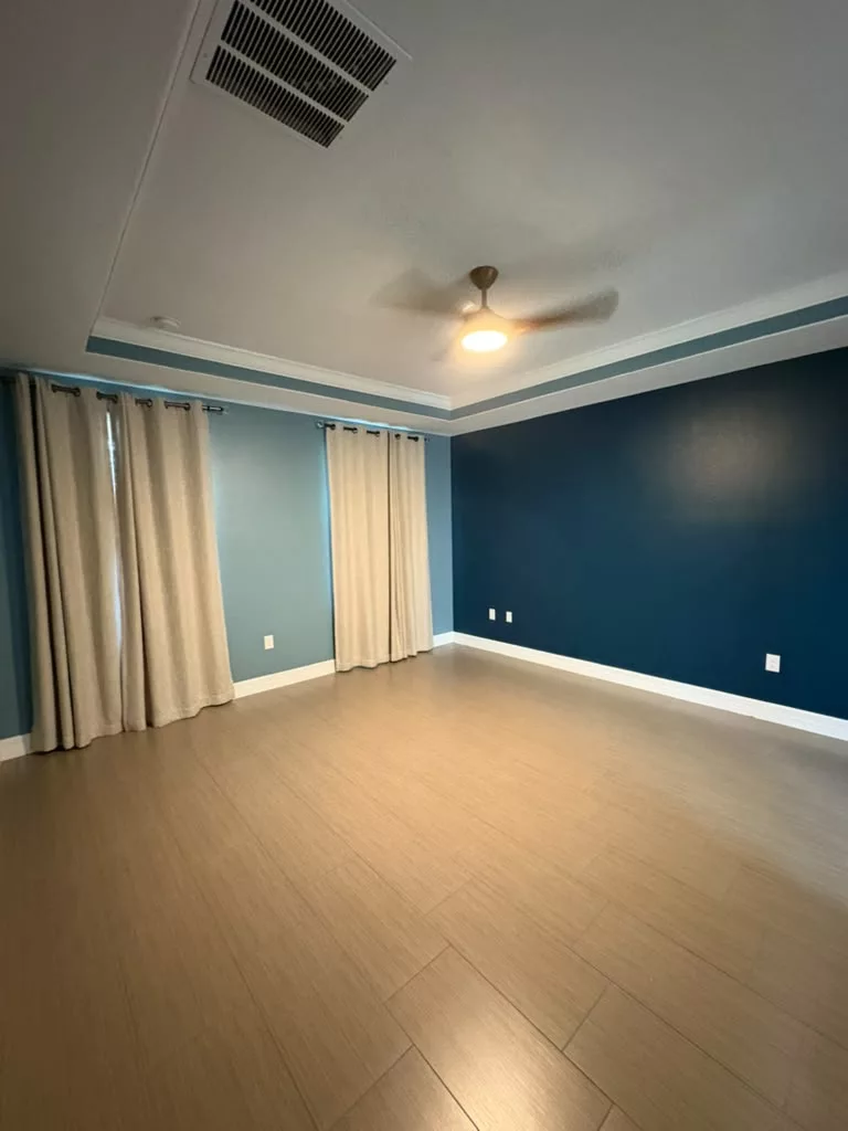 Bedroom with deep blue accent wall